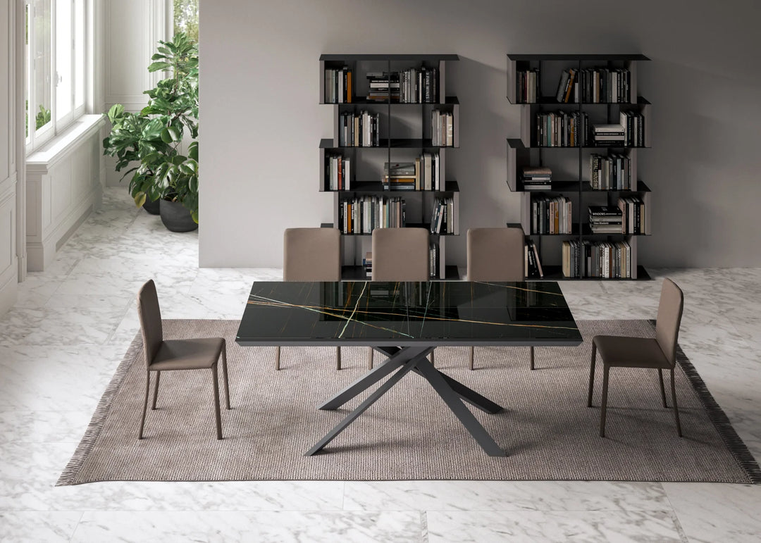 Dining room with the 4x4 black glass table and chairs in a modern interior setting.