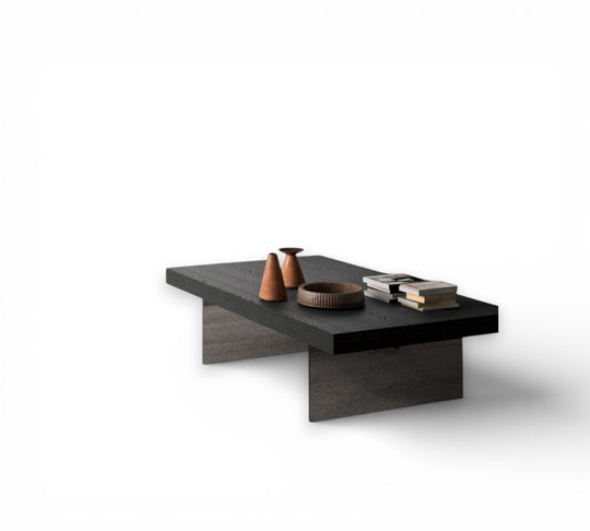 Bellagio modern black coffee table with decorative items on a white background