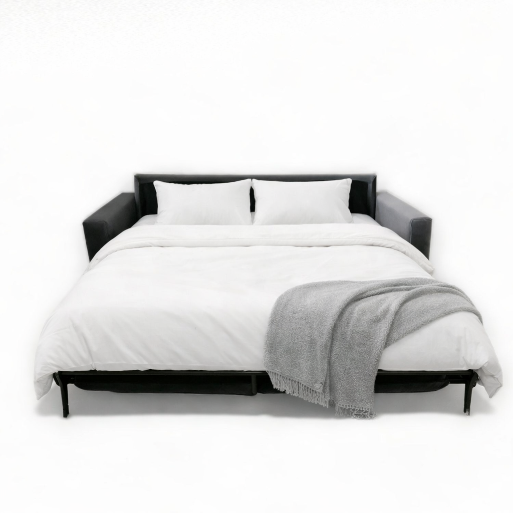 Modern Comfy lux sofa bed with black frame and white bedding 