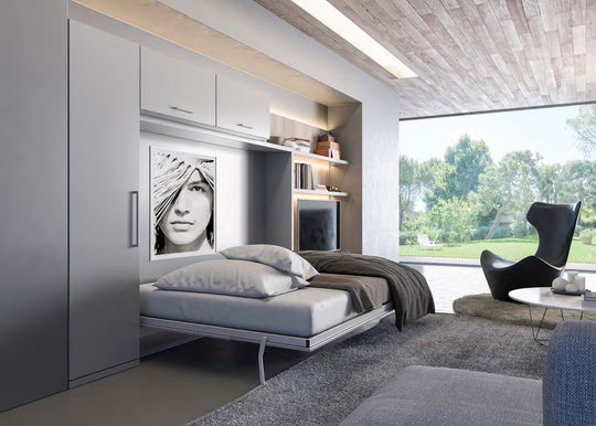 Lateral horizontal murphy bed. Modern bedroom with a bed that pulls out to reveal a seating area, large windows, and a stylish chair.