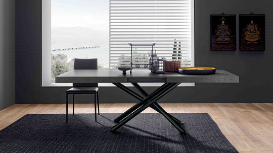 London modern dining table with chairs in a room with large windows and decor.