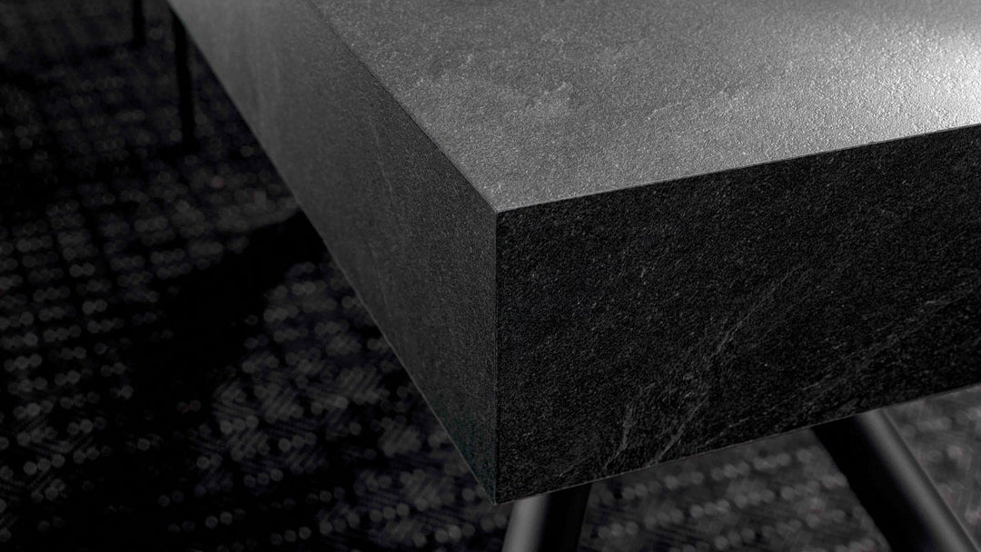 London close-up of a dark stone countertop with a blurred background