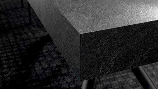 London close-up of a dark stone countertop with a blurred background