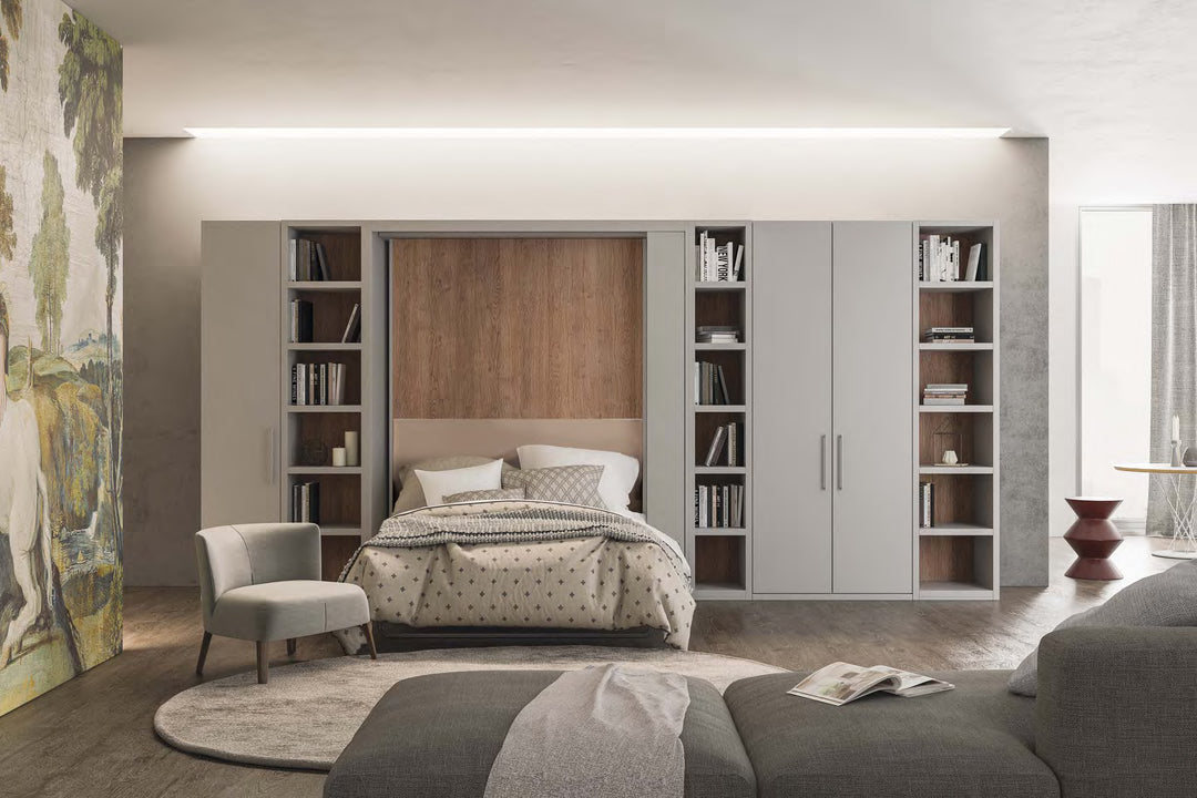 Orbit Swivel wall bed in a living room setup, bookshelves, and a sofa.