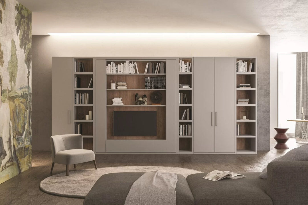 Orbit TV modern bedroom with a large bookshelf unit, sofa, and chair.