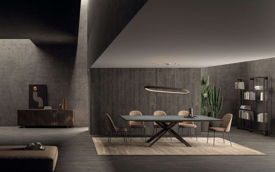 Modern dining room with the 4x4 dark grey table and chairs in a stylish interior setting.
