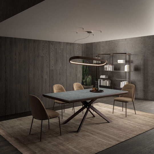 Modern dining room with a large 4x4 table and chairs in a dimly lit room.