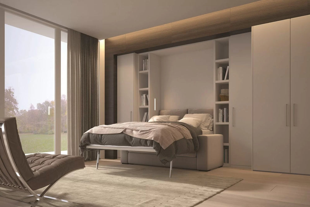 Modern bedroom with our Relax sofa wall bed, chair, and large windows.