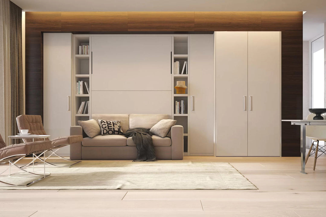 Modern living room with our Relax sofa wall bed, bookshelves, and a large wardrobe.
