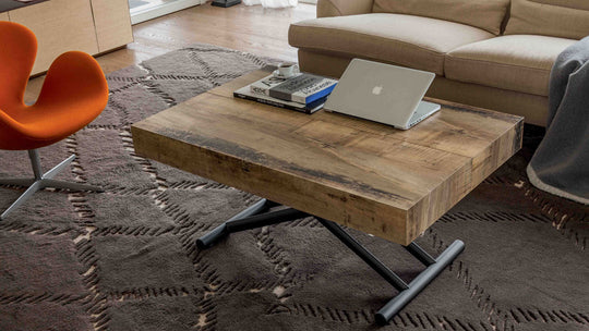 Block raising coffee to dining table 