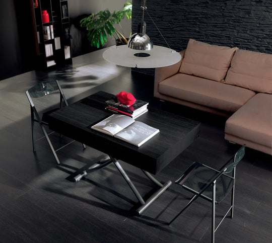Modern living room with a black Box coffee table, chairs, and a beige sofa.