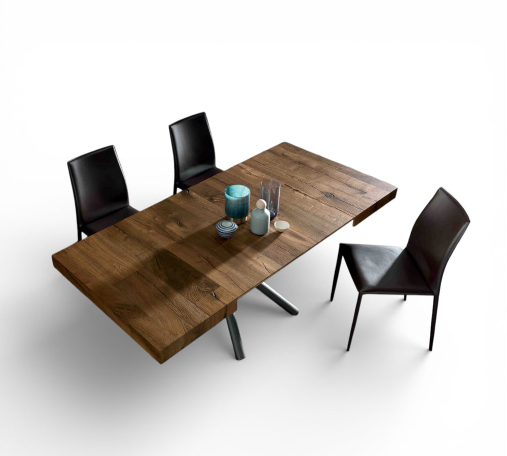 Concept Square wooden dining table with four black chairs on a white background