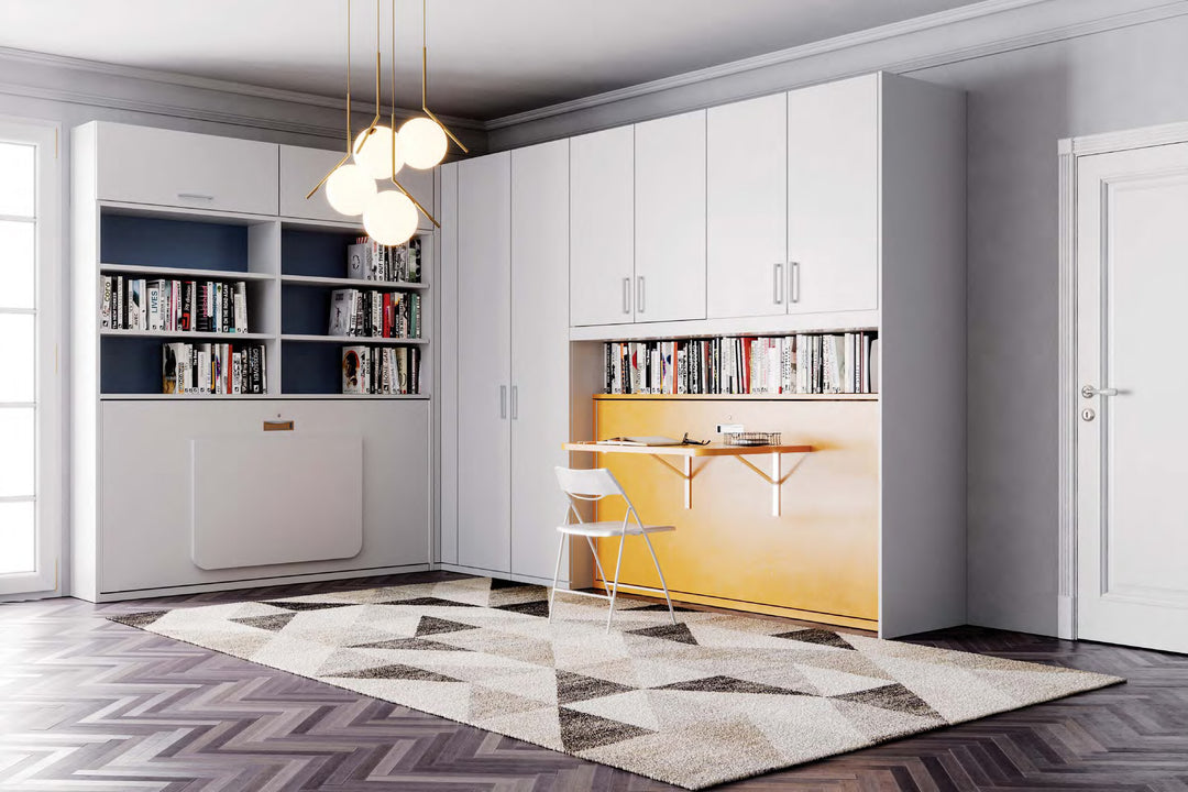 Nest Foldaway Desk single horizontal murphy bed. Modern kitchen with white cabinets, a yellow island, and books on shelves.