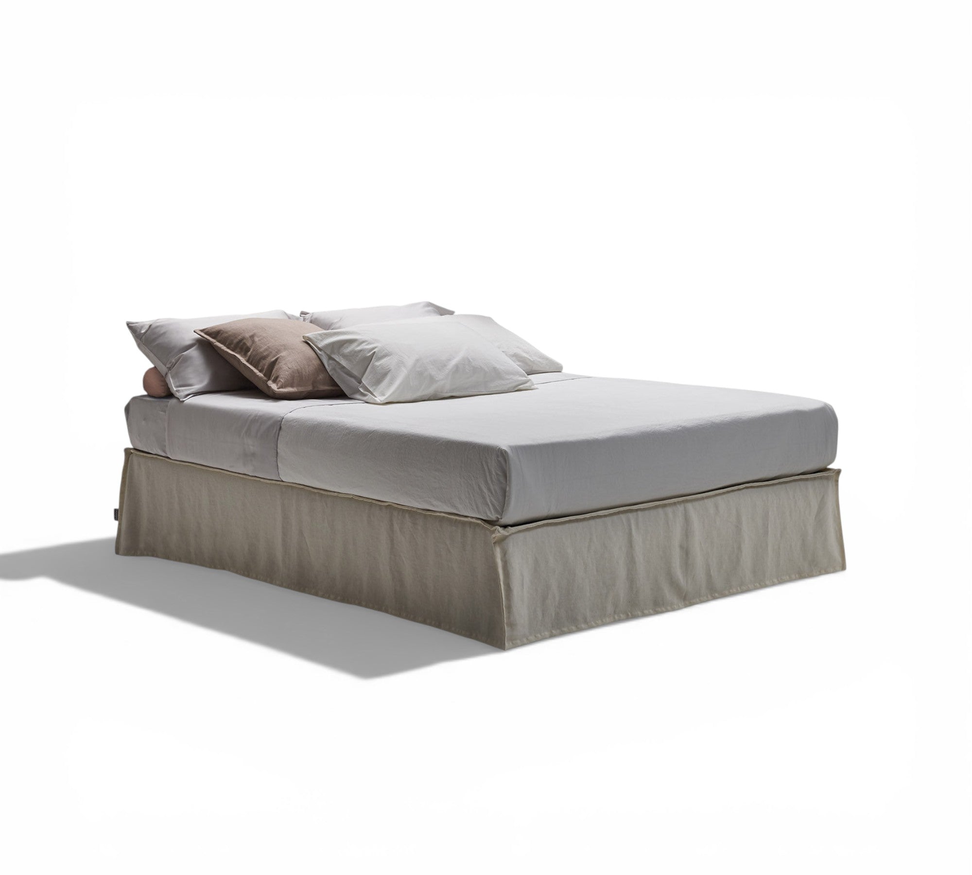 Samar ottoman storage bed with grey bedding and pillows on a white background